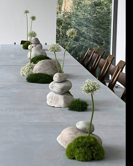 Long table set with stones and greenery