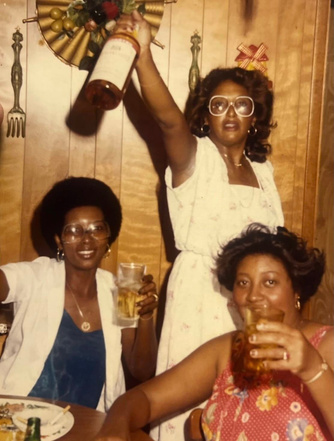 Guests raising glasses at a MEnU supper