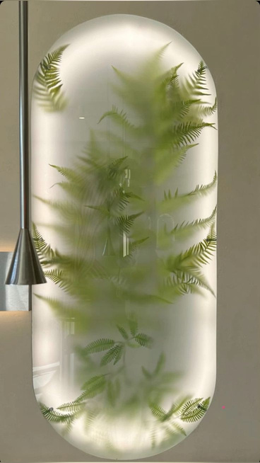 Fern behind frosted glass